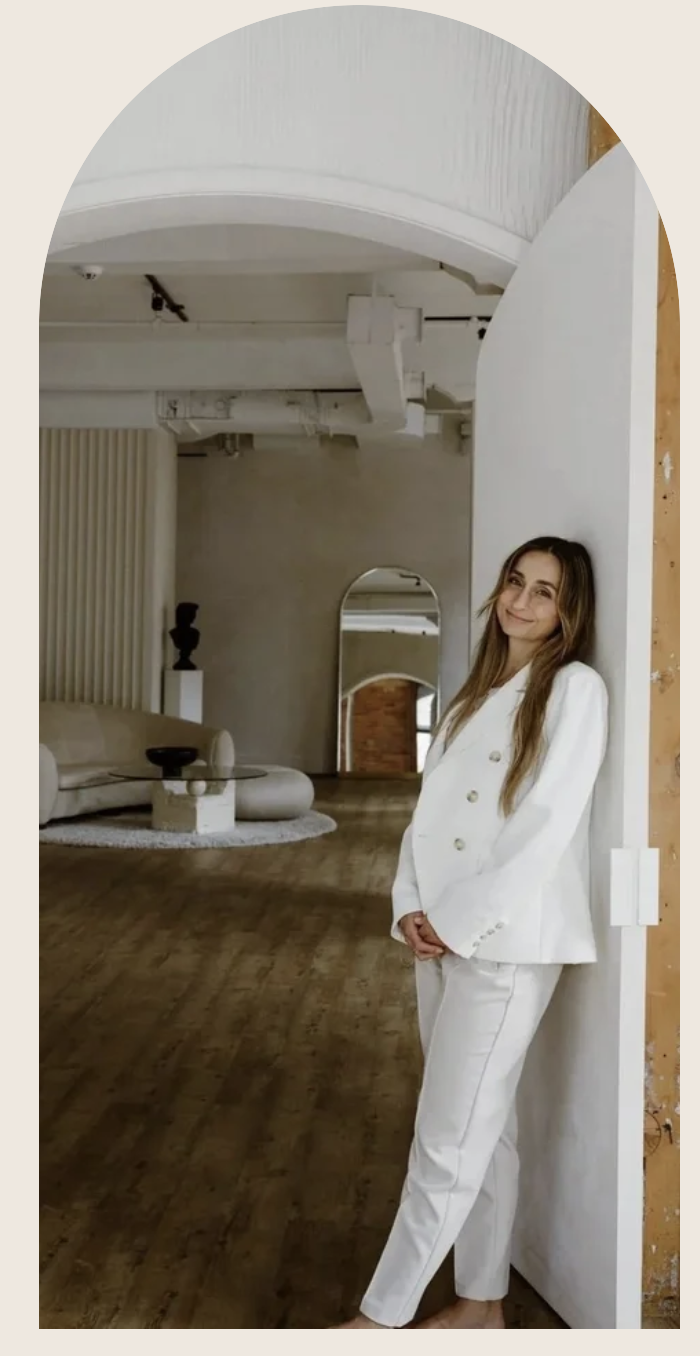 Natalie Kehren standing in an arched doorway